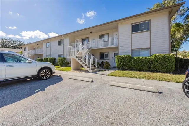 a view of a car park in front of a building