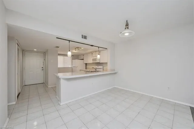 a bathroom with a sink a mirror and a shower