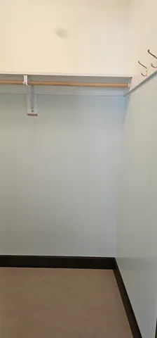 a bathroom with a granite countertop sink and toilet