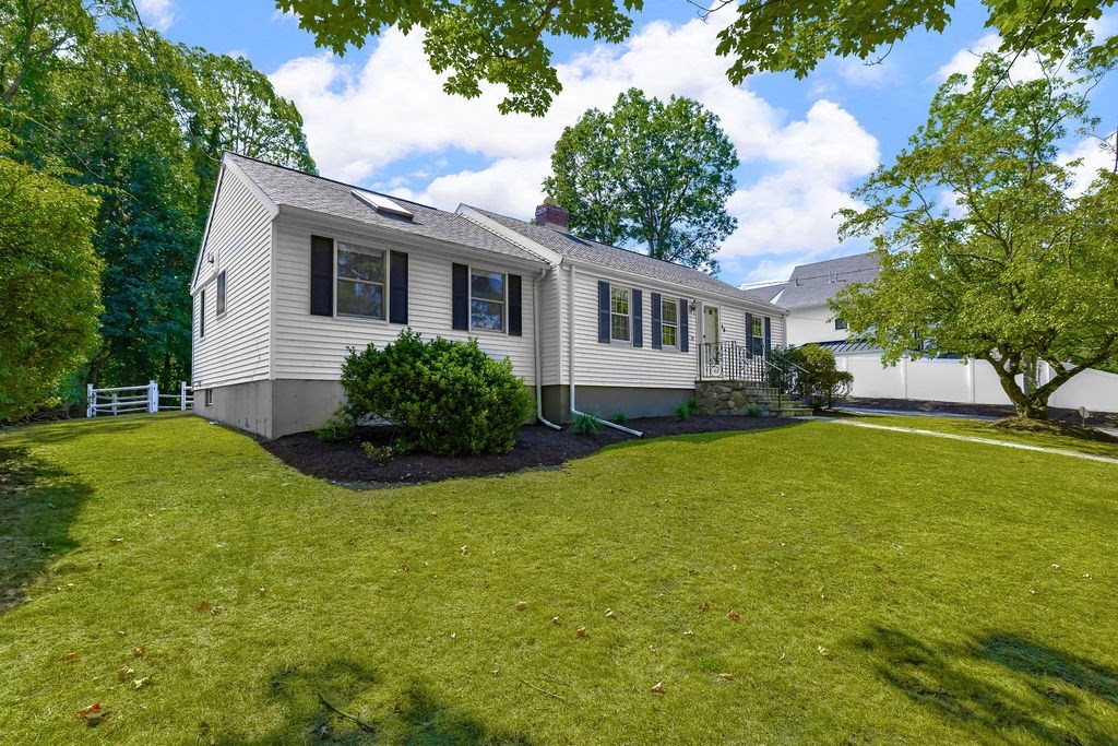 48 Taylor Street Needham, MA 02494 - Photo 3 of 25 a view of a house with a yard patio and swimming pool