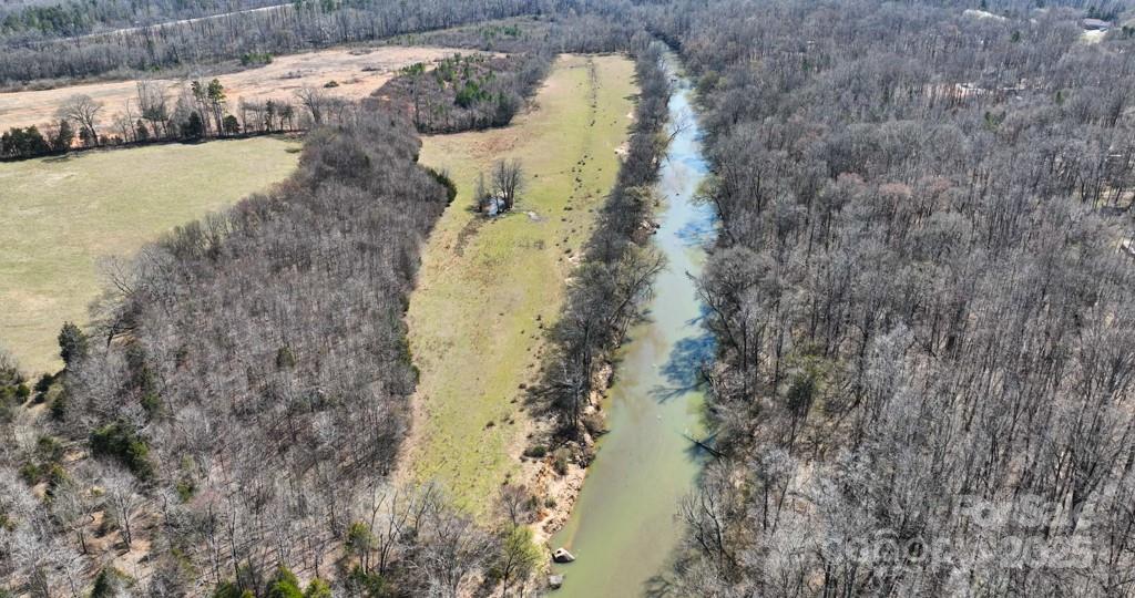3500 Biggers Road Concord, NC 28025 - Photo 6 of 11 a aerial view of a house with a yard and trees in the back