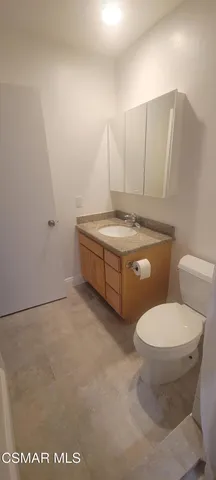 a bathroom with a toilet and a sink