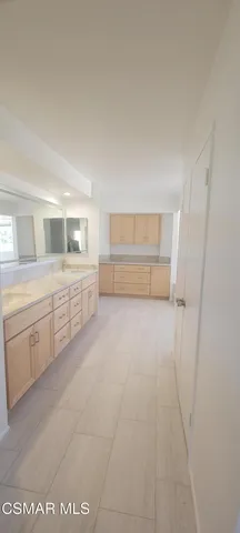 a bathroom with a bathtub and window