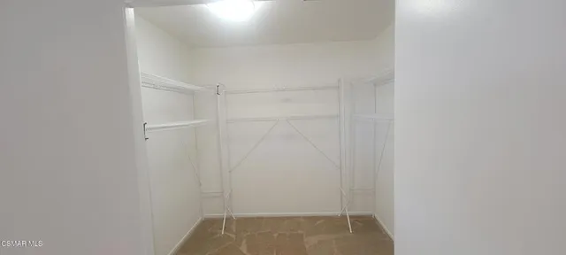 a view of an empty room with windows