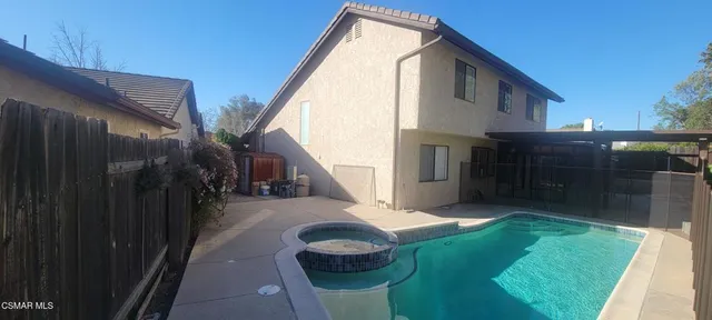 a balcony with view of an outdoor space