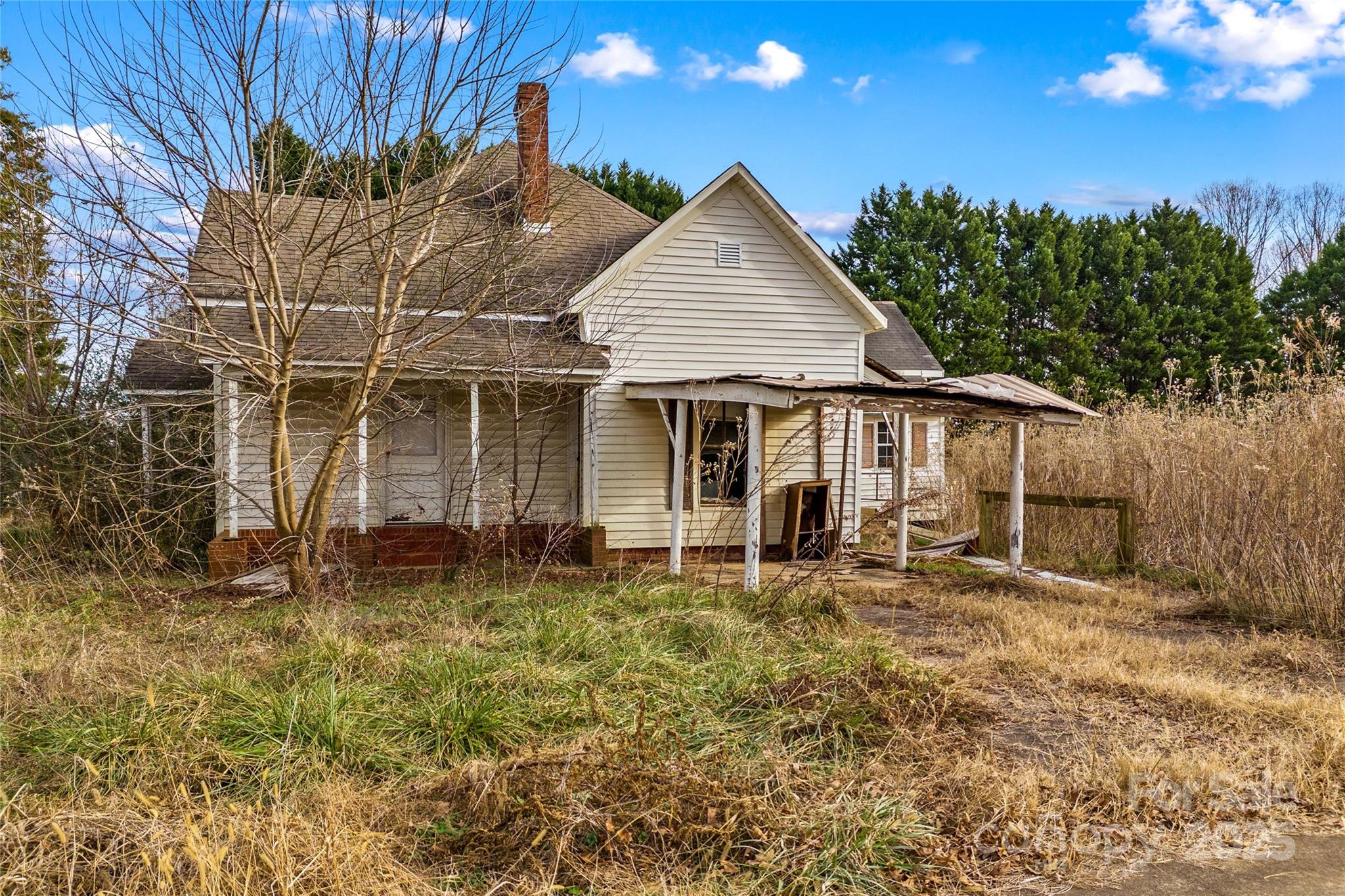 1091 Midway Road Statesville, NC 28625 - Photo 12 of 26 a backyard of a house with yard and outdoor seating