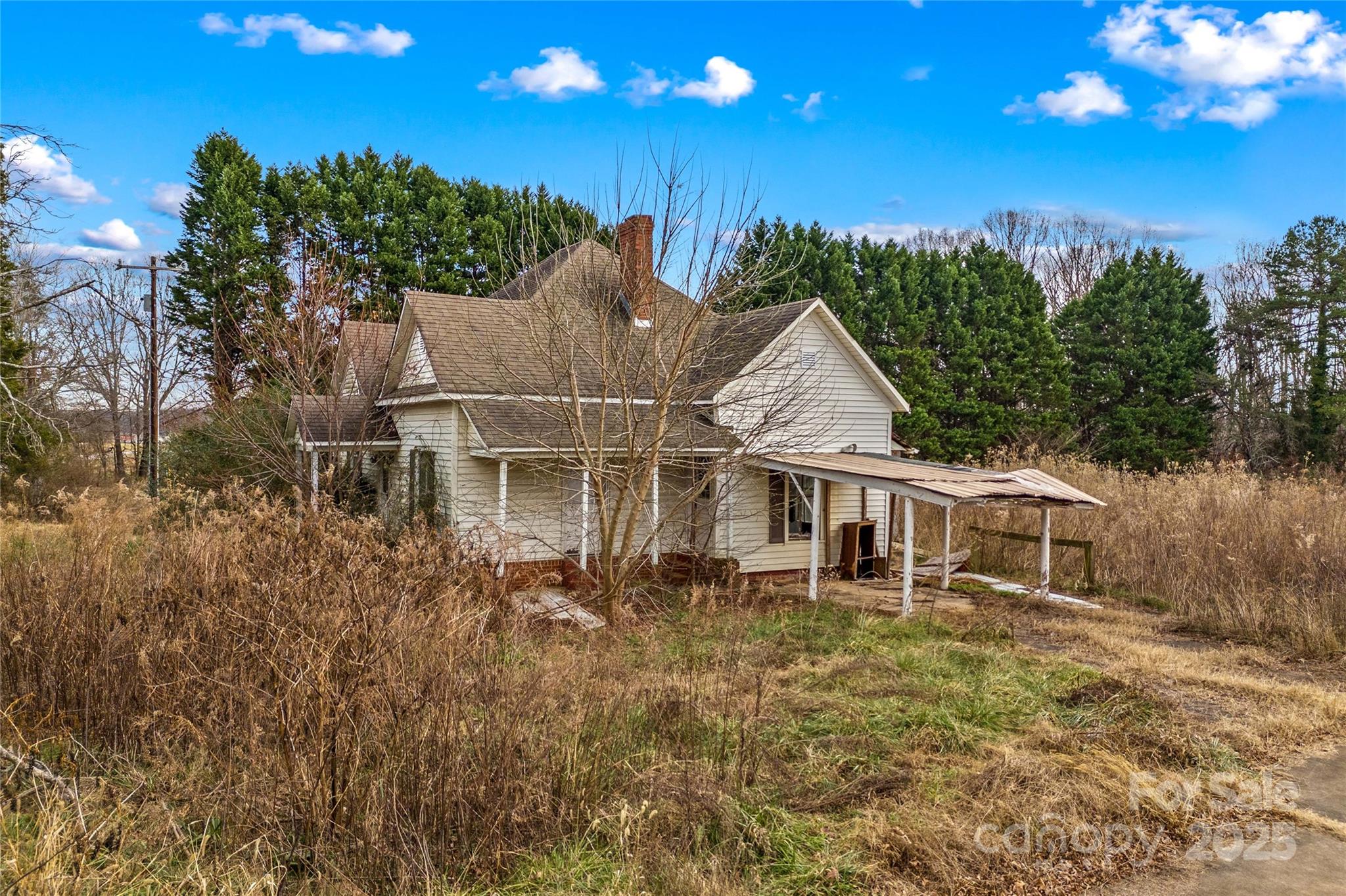 1091 Midway Road Statesville, NC 28625 - Photo 4 of 26 a view of a house with a yard and potted plants