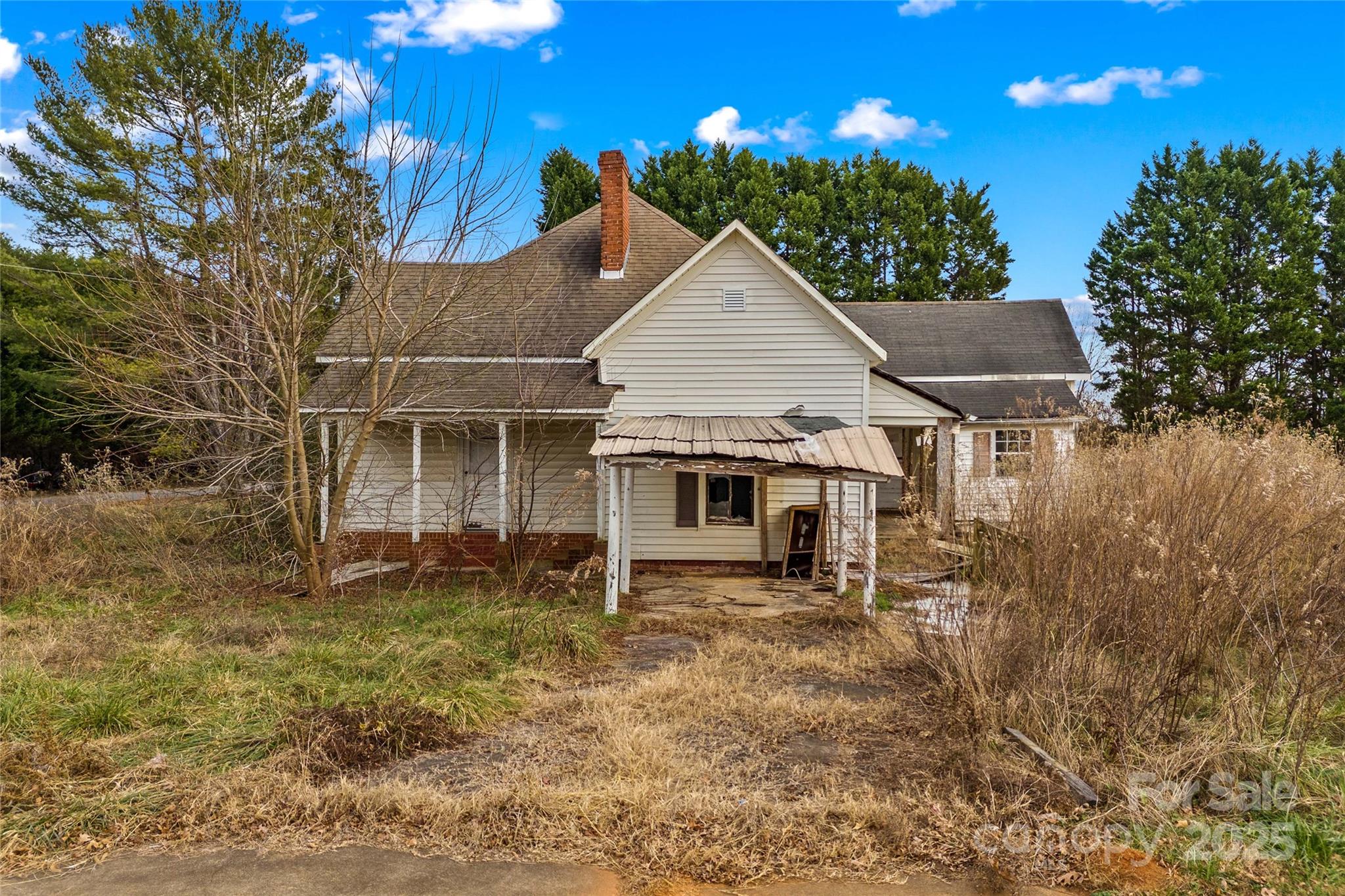 1091 Midway Road Statesville, NC 28625 - Photo 5 of 26 a view of a house with a yard