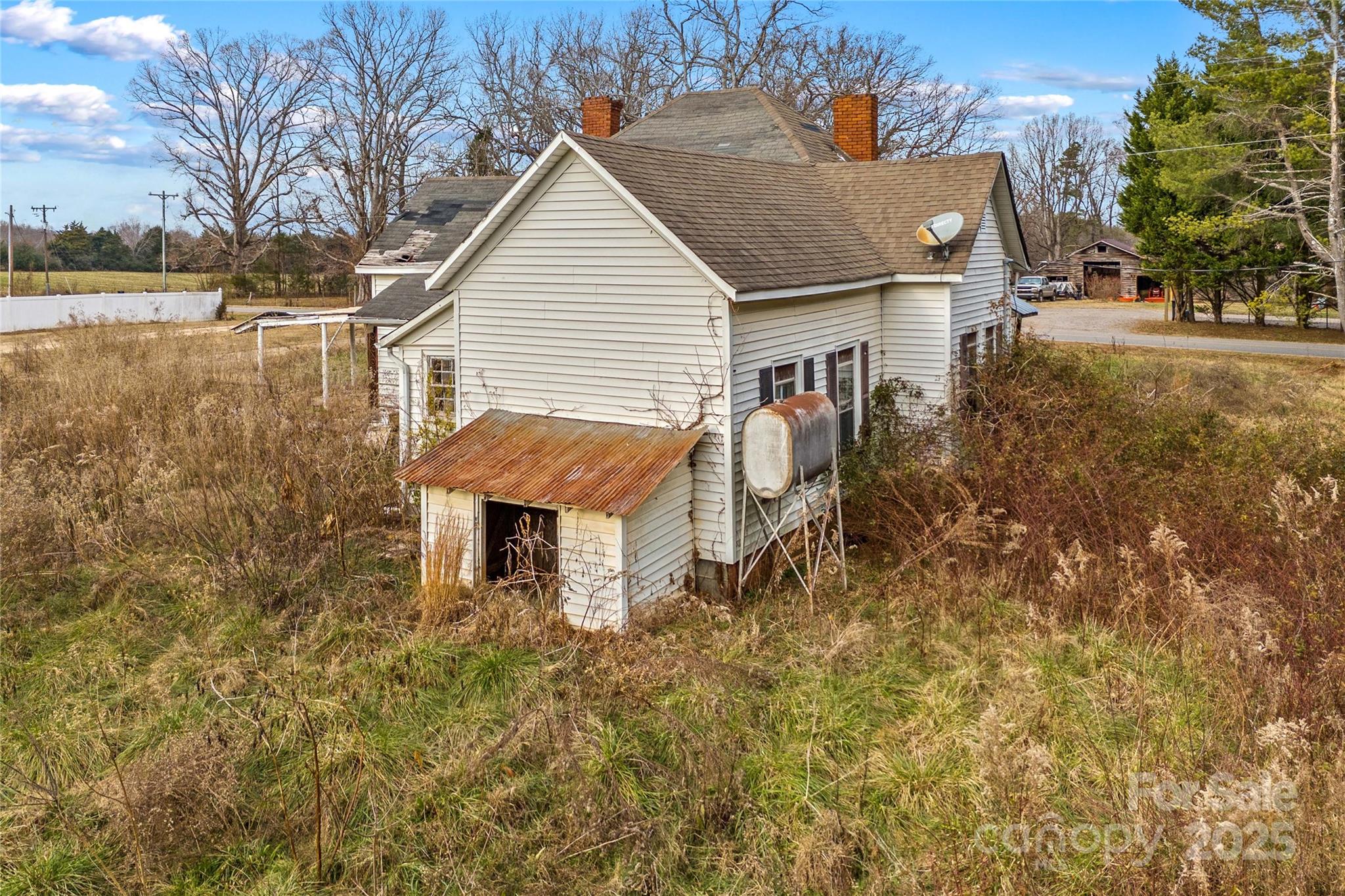 1091 Midway Road Statesville, NC 28625 - Photo 9 of 26 a view of a house with a yard and sitting area