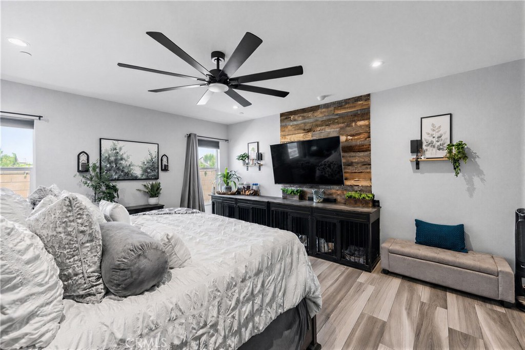 34512 Burnt Pine Road Murrieta, CA 92563 - Photo 6 of 21 a bedroom with a bed and a flat screen tv