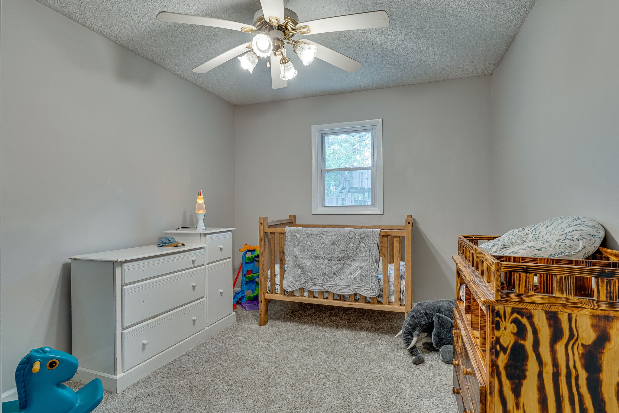 1883 Boynton Valley Road Manchester, TN 37355 - Photo 13 of 17 a bedroom with a bed and a chandelier