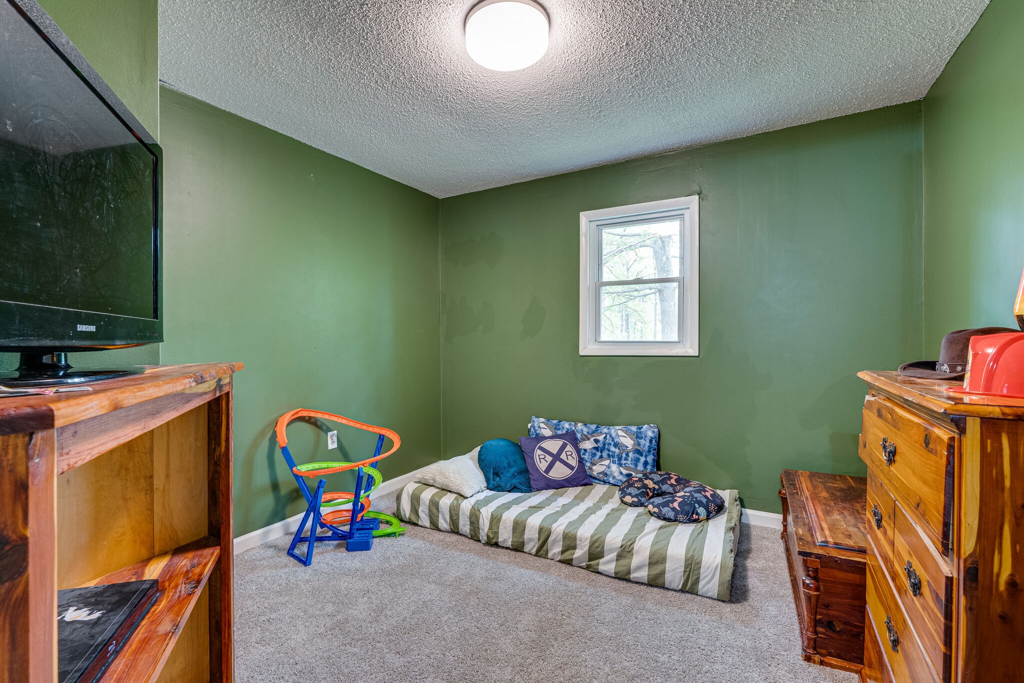 1883 Boynton Valley Road Manchester, TN 37355 - Photo 14 of 17 a bedroom with furniture and a flat screen tv