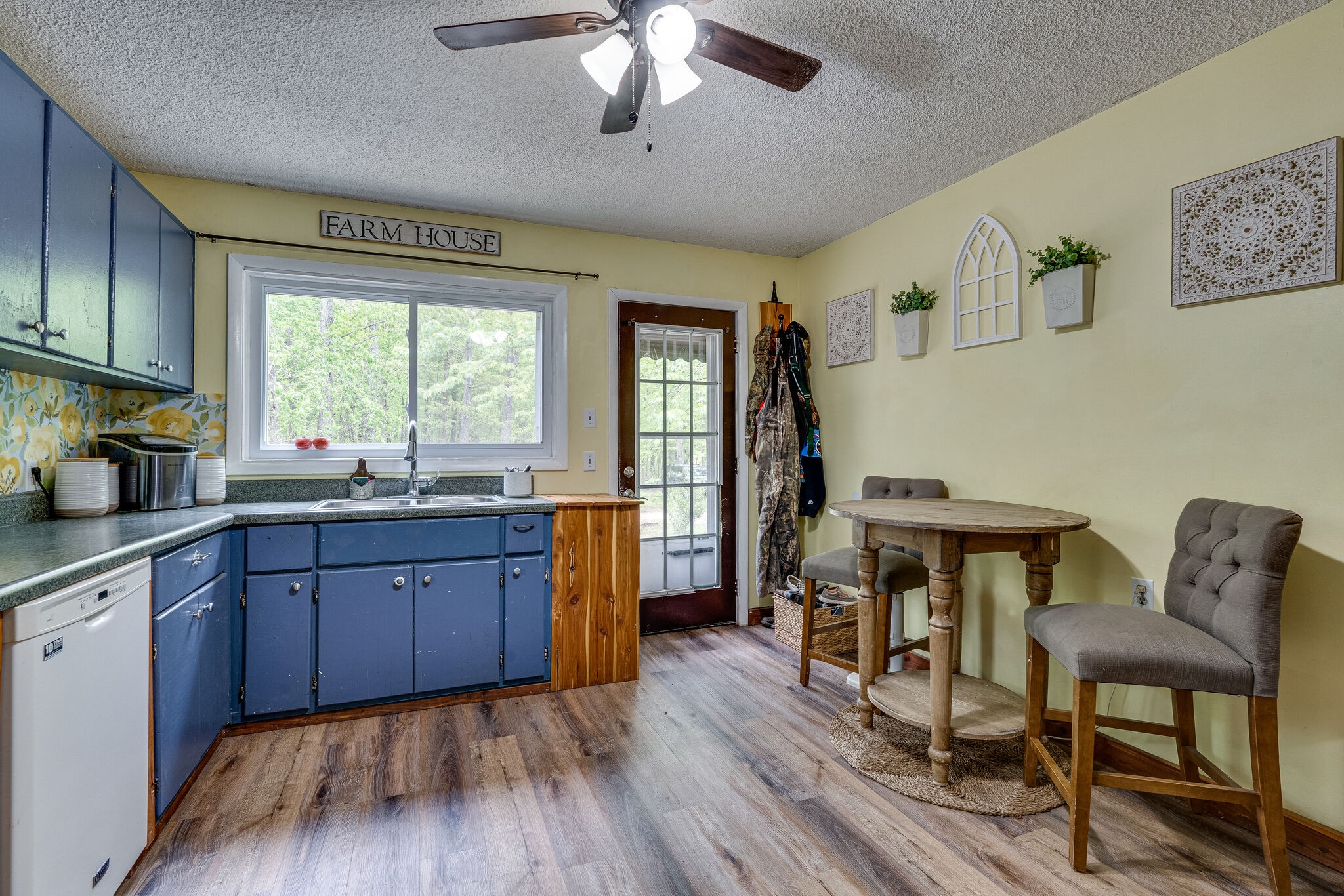 1883 Boynton Valley Road Manchester, TN 37355 - Photo 8 of 17 a kitchen with granite countertop wooden floors and wooden cabinets
