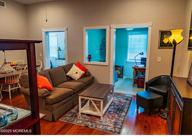 a living room with furniture and a rug