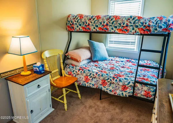 a bedroom with a bed and a table in it