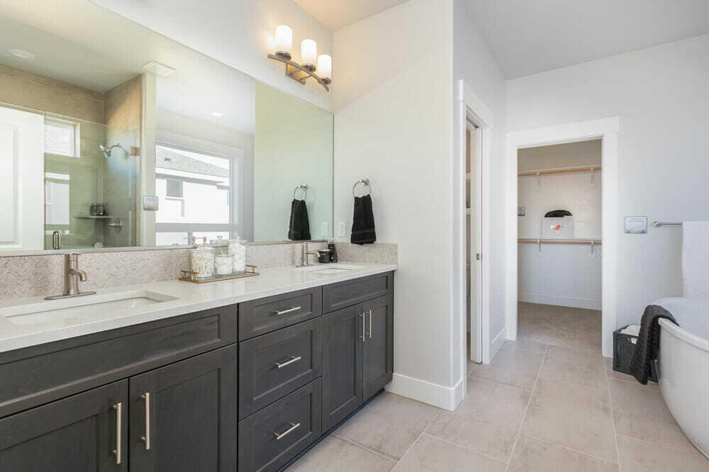 3803 Northeast Oakside Loop Bend, OR 97701 - Photo 12 of 22 a spacious bathroom with a granite countertop sink a mirror and a