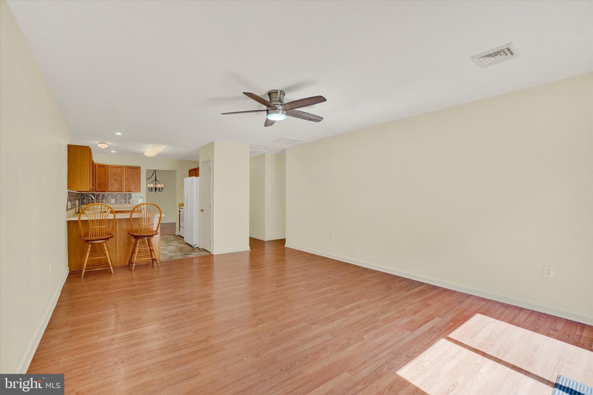 7172 Seneca Ridge Drive York, PA 17403 - Photo 11 of 18 a view of an empty room with a window and wooden floor