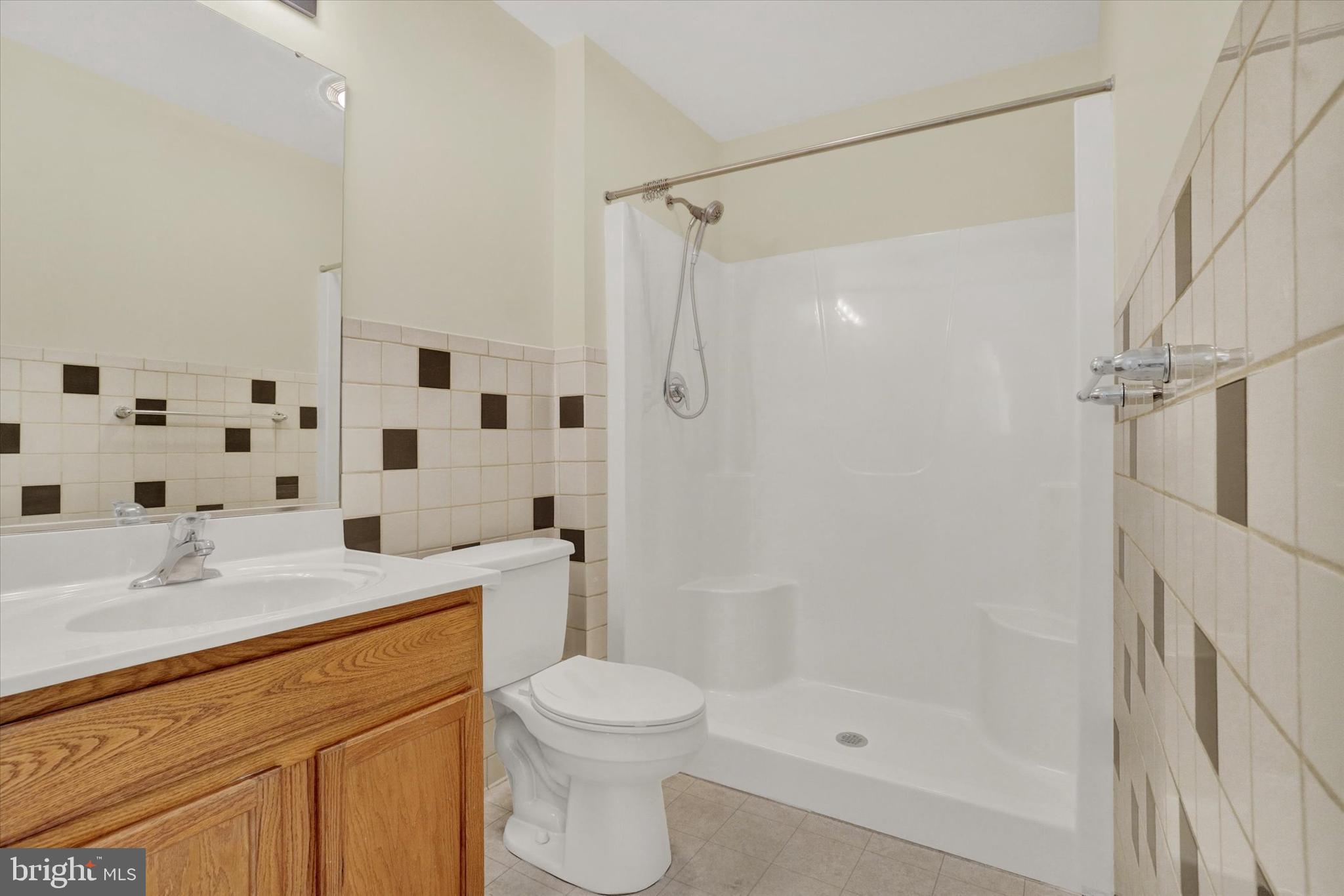 7172 Seneca Ridge Drive York, PA 17403 - Photo 14 of 18 a bathroom with a sink a toilet and shower
