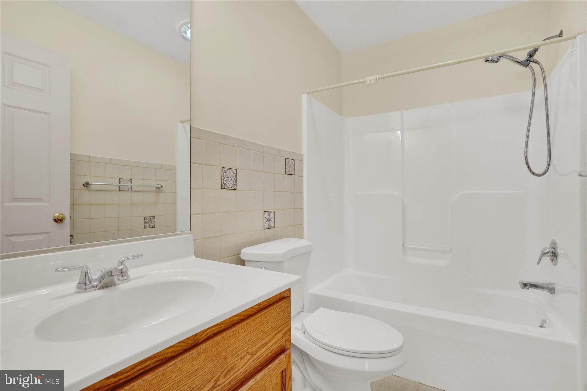 7172 Seneca Ridge Drive York, PA 17403 - Photo 15 of 18 a bathroom with a granite countertop sink toilet and shower
