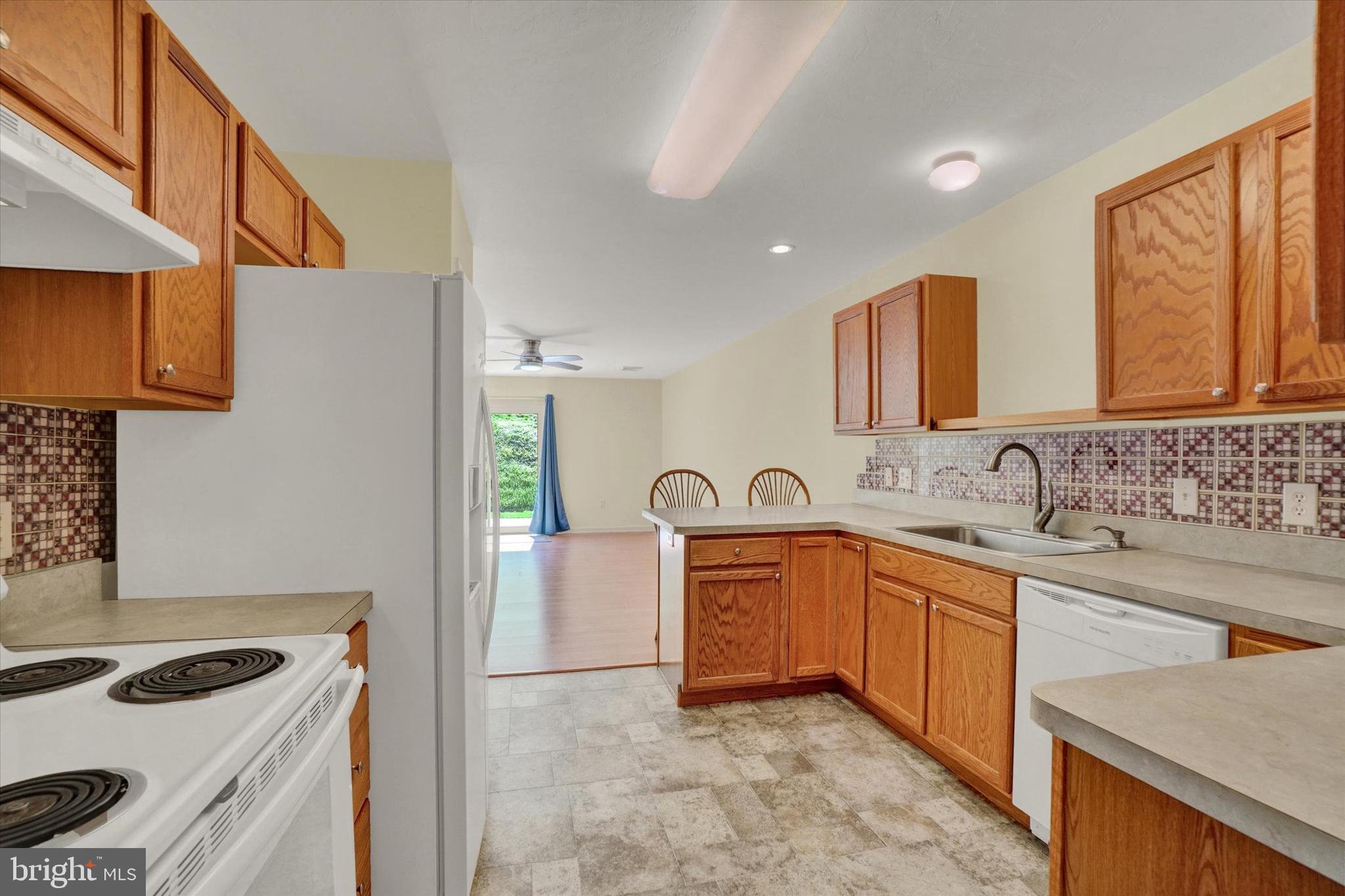 7172 Seneca Ridge Drive York, PA 17403 - Photo 7 of 18 a kitchen with stainless steel appliances granite countertop a sink stove and cabinets