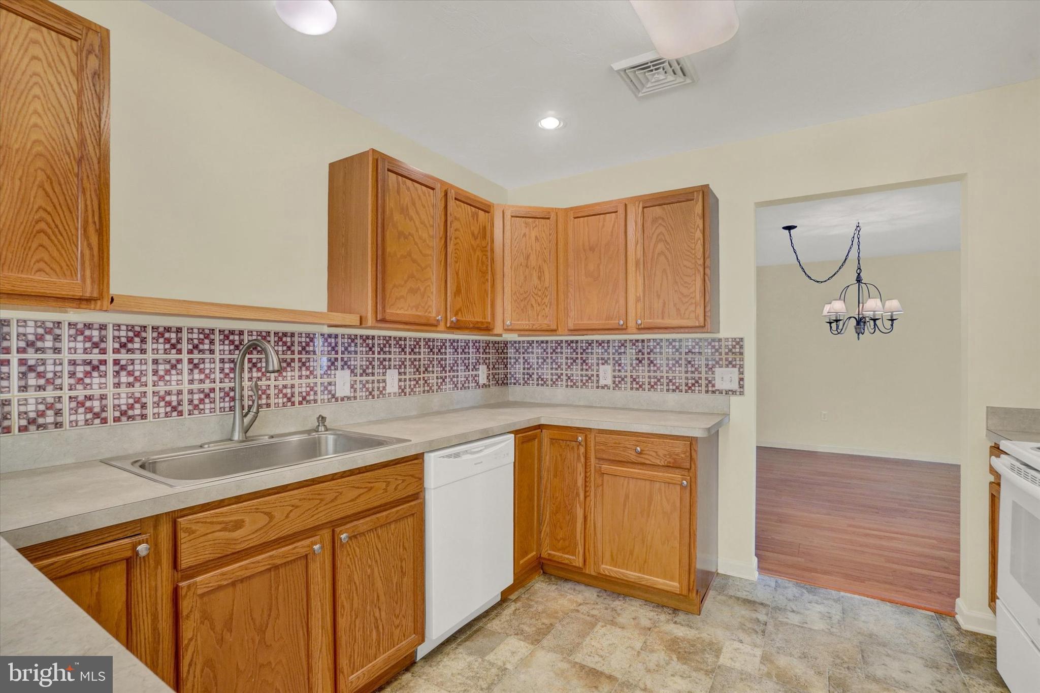 7172 Seneca Ridge Drive York, PA 17403 - Photo 9 of 18 a kitchen with sink cabinets and window