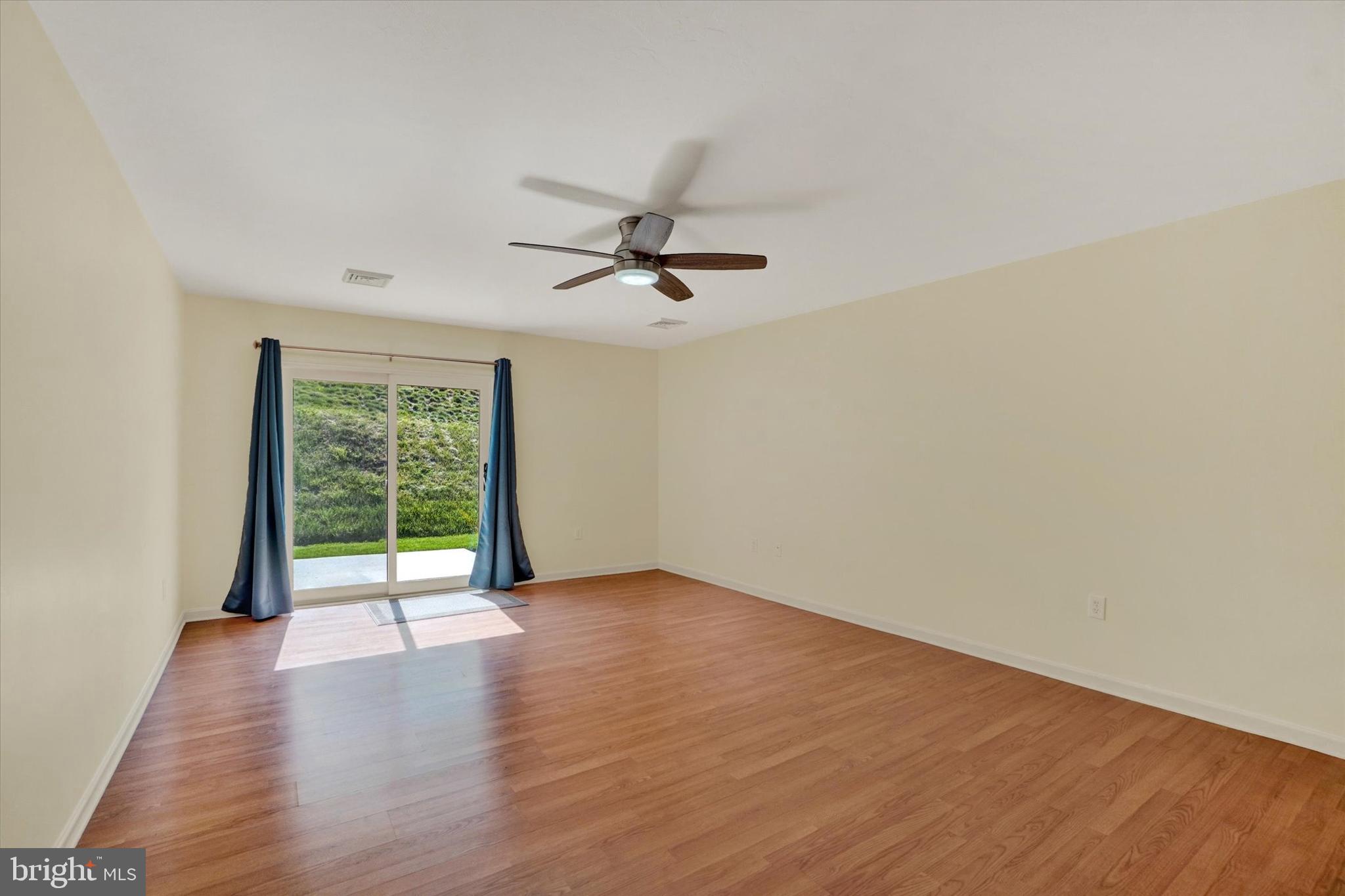 7172 Seneca Ridge Drive York, PA 17403 - Photo 10 of 18 wooden floor in an empty room with a window
