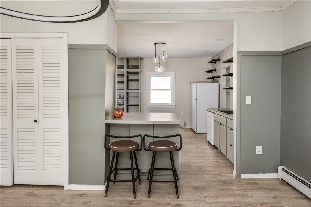 174 Fuller Avenue Corning, NY 14830 - Photo 12 of 46 DR into kitchen/island seating