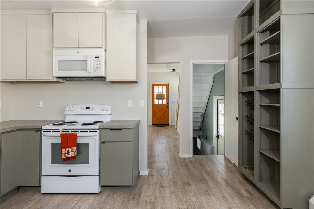 174 Fuller Avenue Corning, NY 14830 - Photo 19 of 46 Kitchen into LR and basement