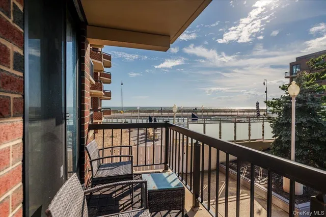 a view of a balcony with seating space