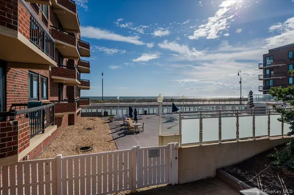 a view of balcony with wooden floor and outdoor seating