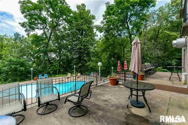 a view of a swimming pool with a patio