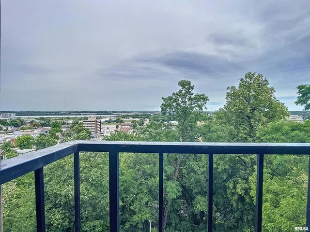 a view of a balcony with an outdoor space
