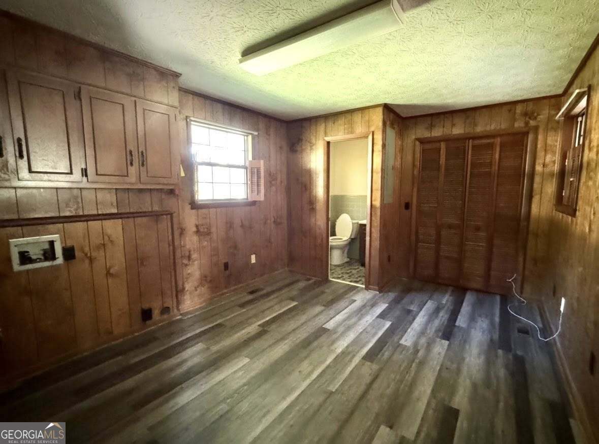 2471 Highway 441 Dublin, GA 31021 - Photo 14 of 18 a view of a room with wooden floor and wardrobe
