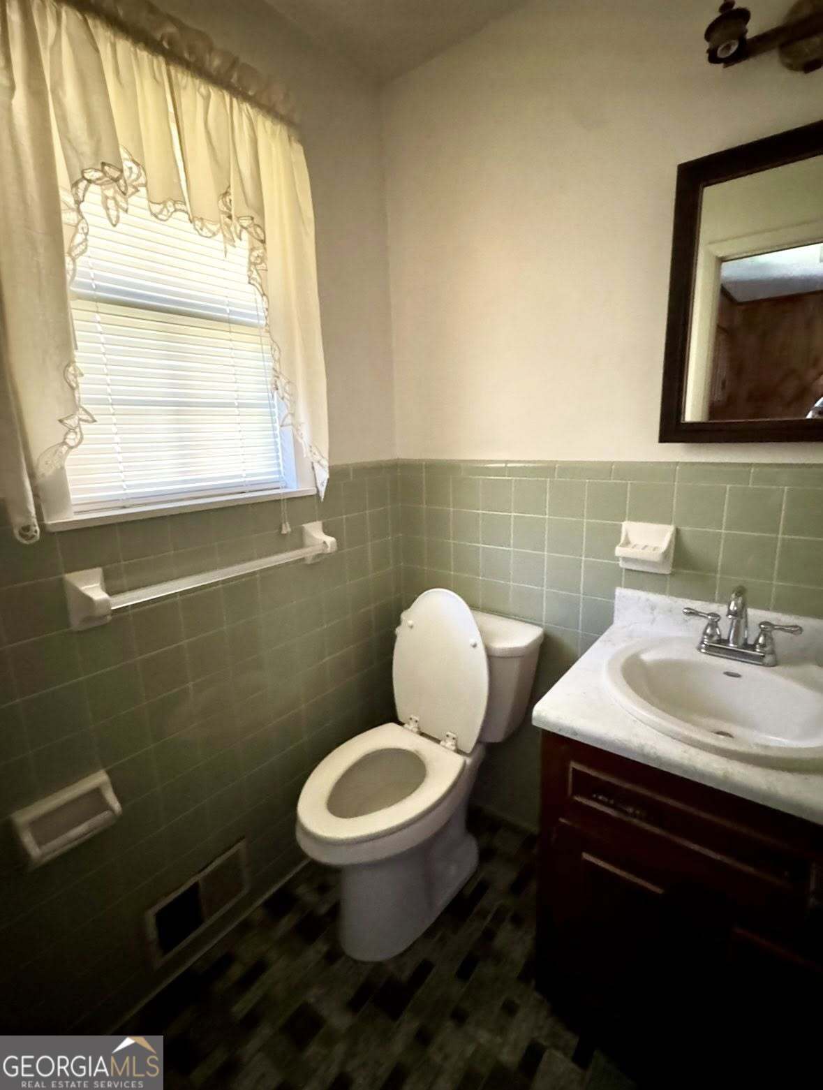 2471 Highway 441 Dublin, GA 31021 - Photo 15 of 18 a bathroom with a toilet sink and mirror