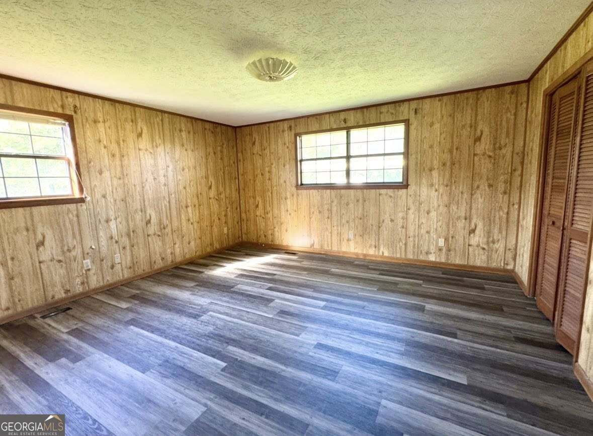 2471 Highway 441 Dublin, GA 31021 - Photo 10 of 18 a view of empty room with wooden floor and fan