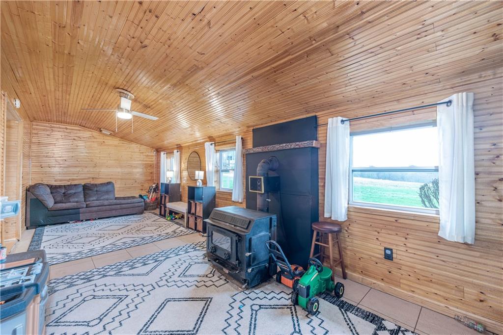 320 Deerfield Road Washington, PA 15301 - Photo 7 of 32 The knotty pine continues into the family room with a wood burner fireplace. Gives you that rustic cabin feel. Who needs to rent a cabin in the woods when you have this.