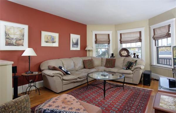 82 Walnut Street, Unit 3 Brookline, MA 02445 - Photo 2 of 4 a living room with furniture a rug and a window