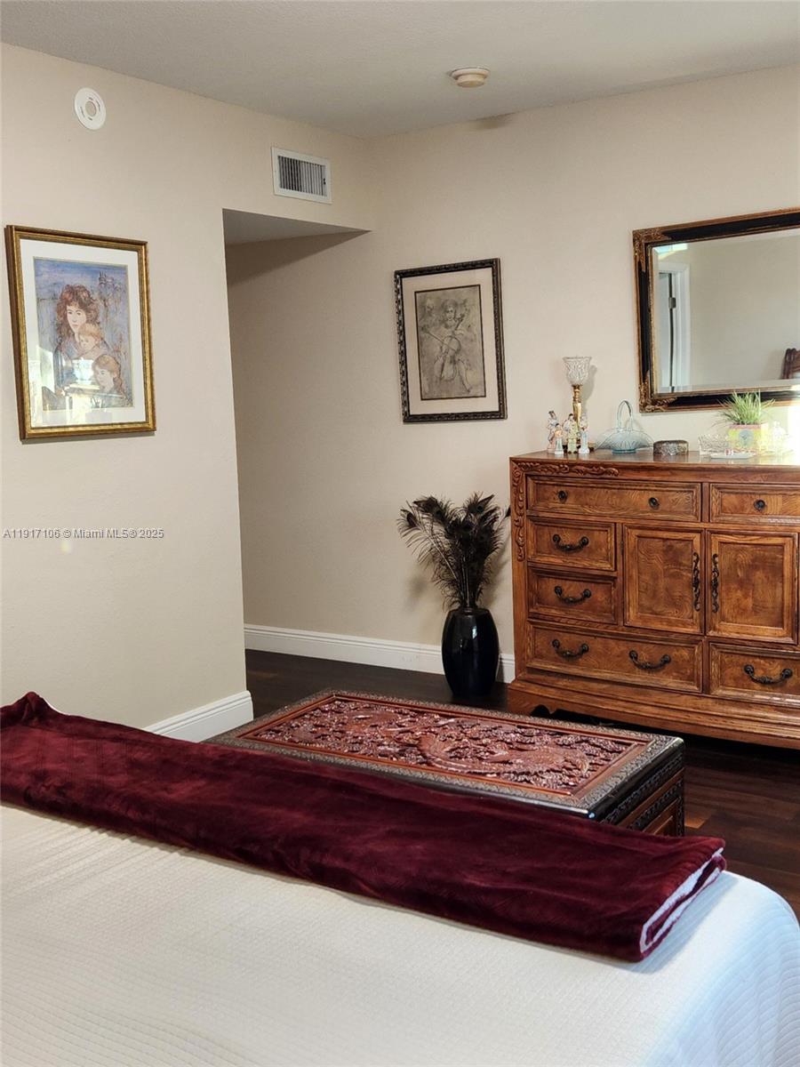 6731 Cypress Road, Unit 411 Plantation, FL 33317 - Photo 24 of 32 a living room with a couch and dresser