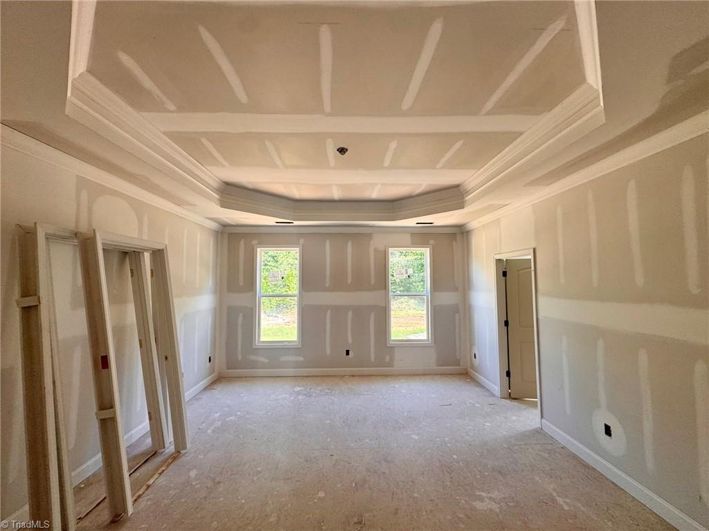 266 Mt Zion Church Road Stokesdale, NC 27357 - Photo 17 of 34 primary bedroom with trey ceiling and crown molding