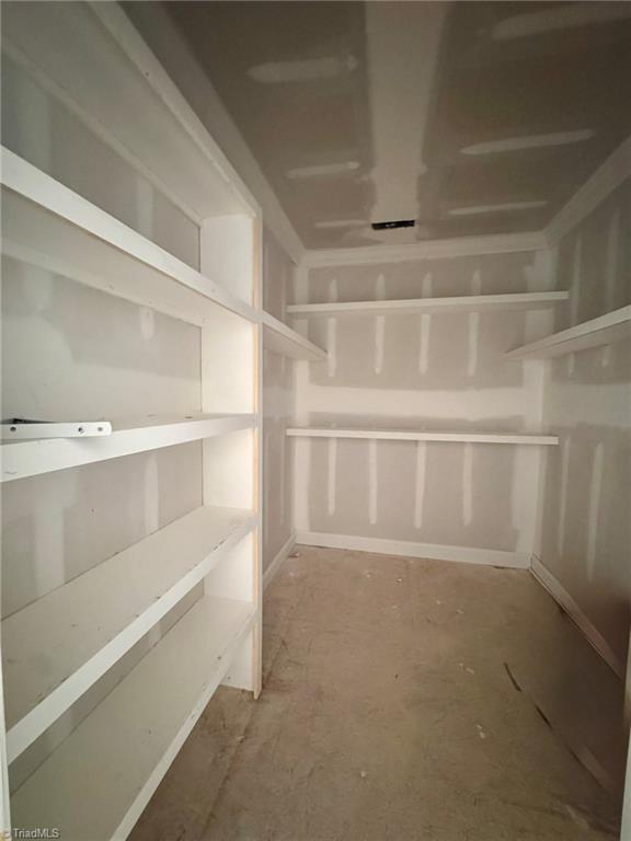 266 Mt Zion Church Road Stokesdale, NC 27357 - Photo 24 of 34 large primary closet with build-ins