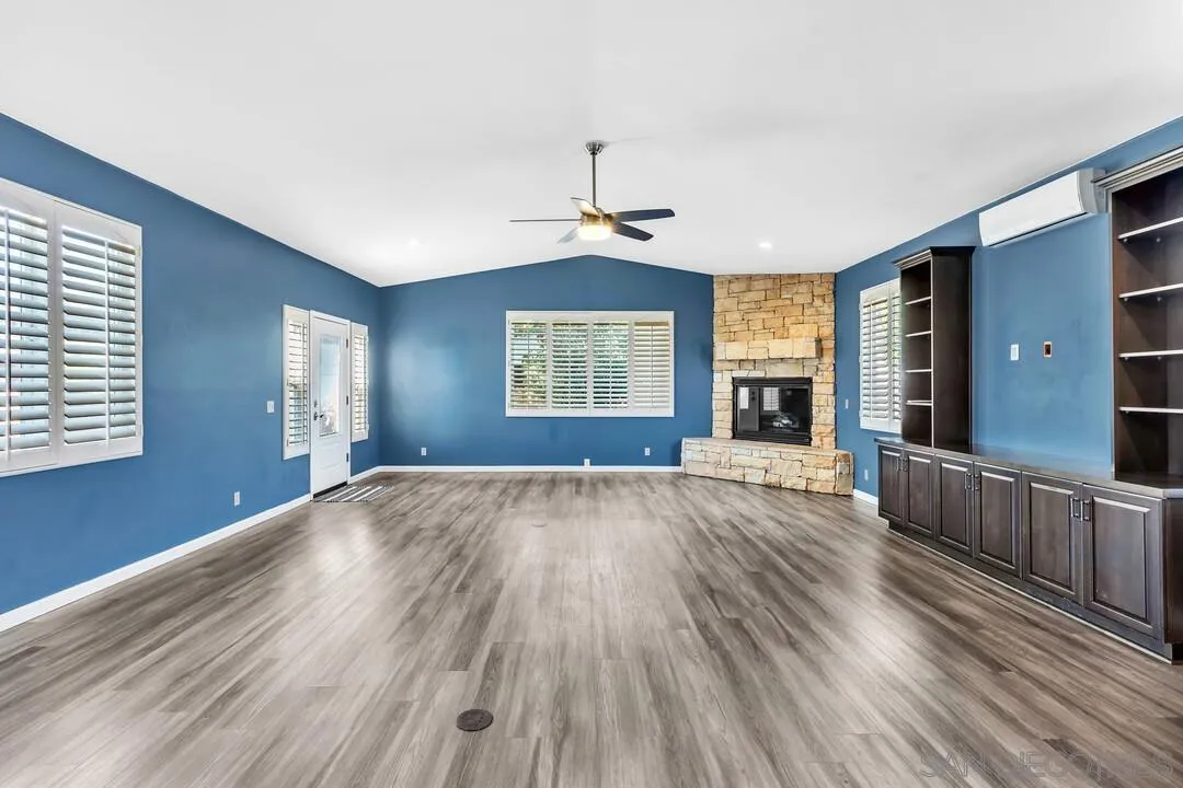 4502 Milton Street San Diego, CA 92110 - Photo 12 of 51 a view of an empty room with wooden floor and a window