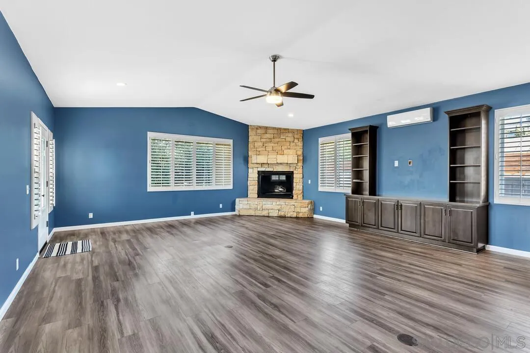4502 Milton Street San Diego, CA 92110 - Photo 14 of 51 a view of an empty room with wooden floor and a window