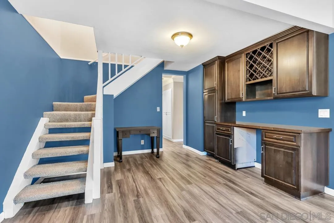 4502 Milton Street San Diego, CA 92110 - Photo 17 of 51 a view of entryway and hall with wooden floor