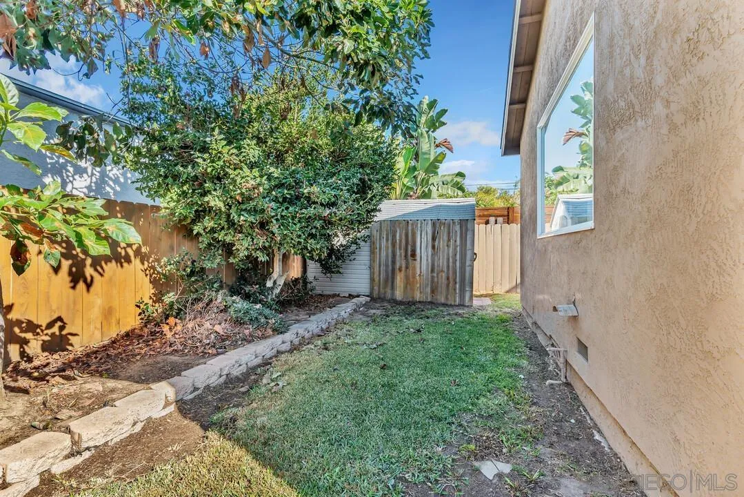 4502 Milton Street San Diego, CA 92110 - Photo 40 of 51 a view of a house with a backyard