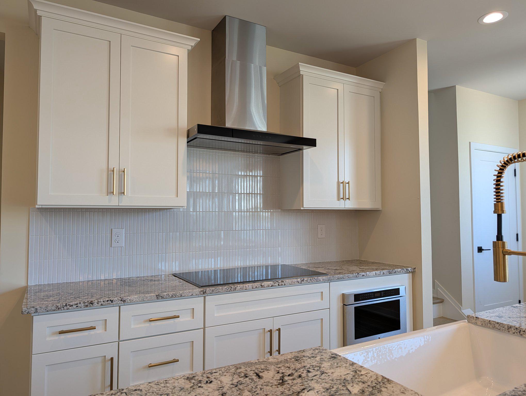 141 South Lore's Landing Road Middletown, DE 19709 - Photo 11 of 60 a kitchen with granite countertop white cabinets and stainless steel appliances