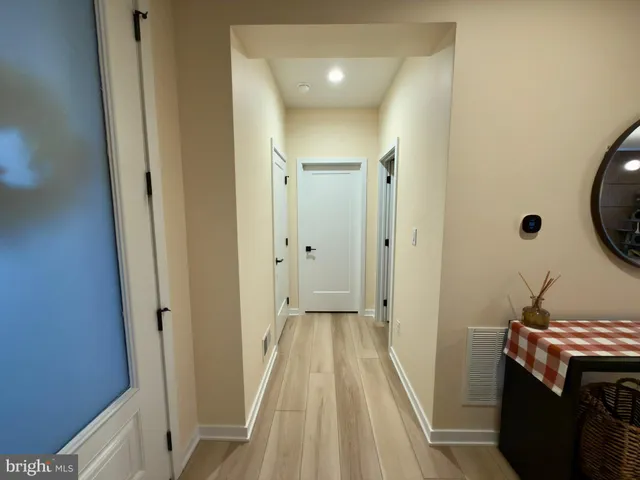 a view of a bathroom from a hallway