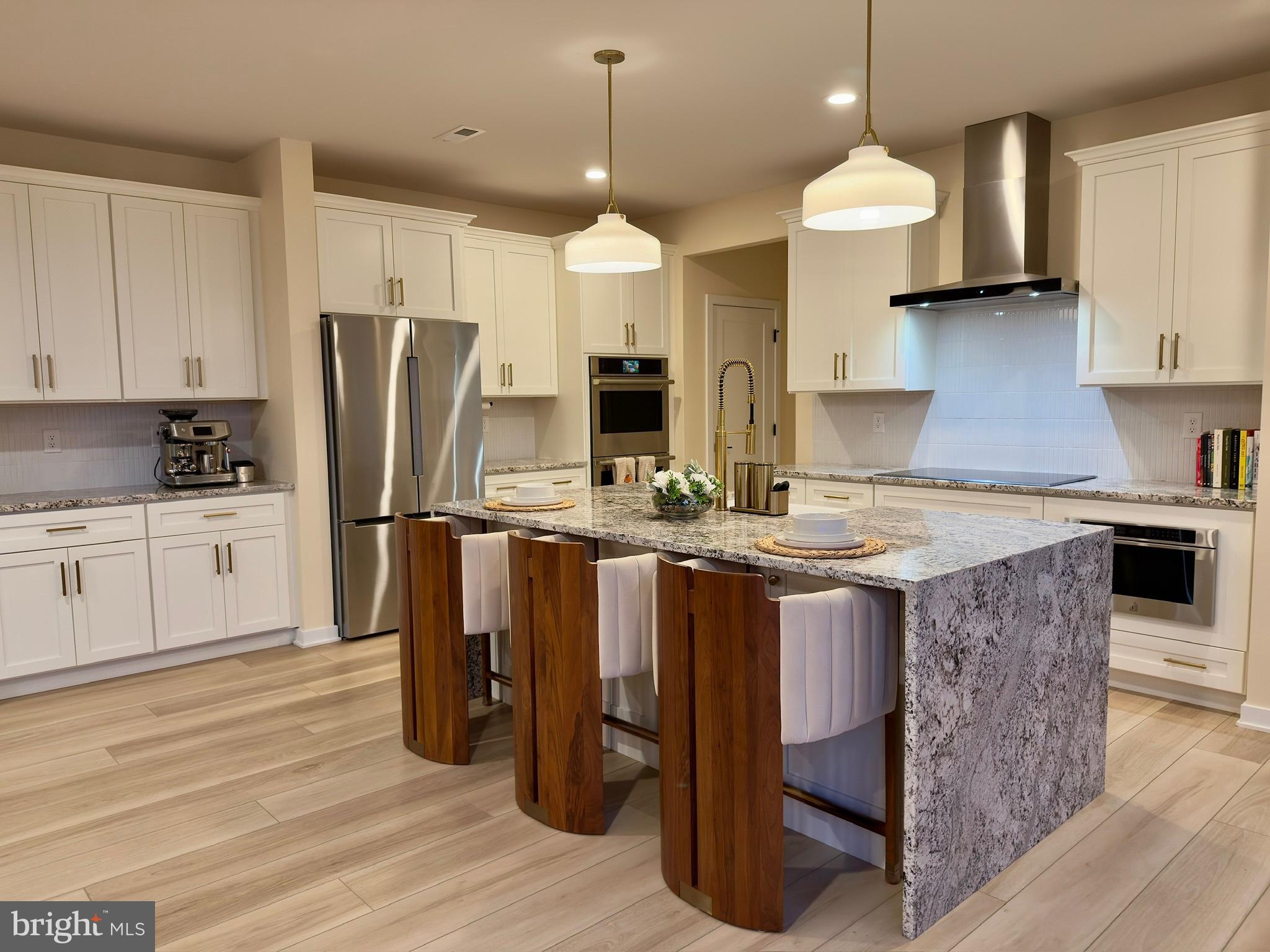 141 South Lore's Landing Road Middletown, DE 19709 - Photo 14 of 60 a kitchen with kitchen island granite countertop a sink a center island and stainless steel appliances