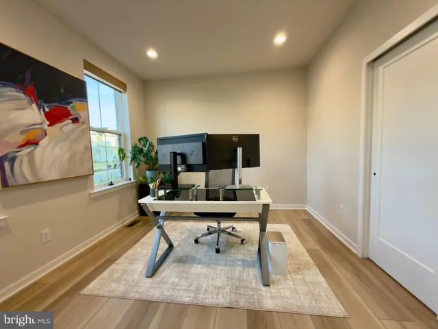 a workspace with furniture and window