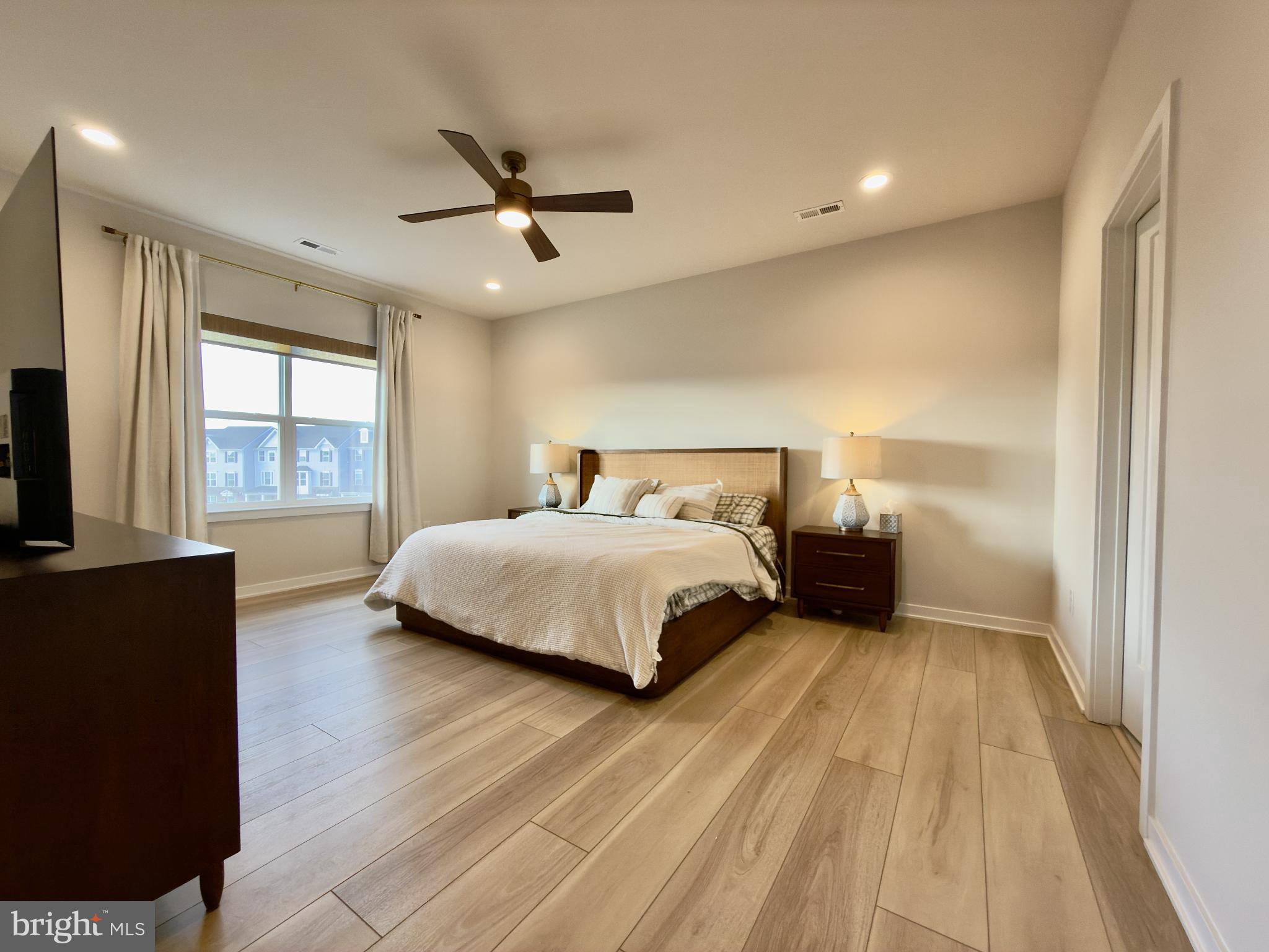 141 South Lore's Landing Road Middletown, DE 19709 - Photo 23 of 60 a bedroom with a bed and a large window