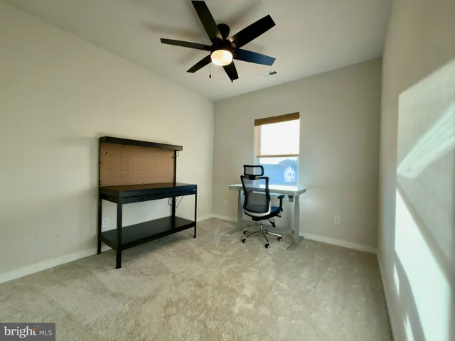 a view of a workspace with furniture